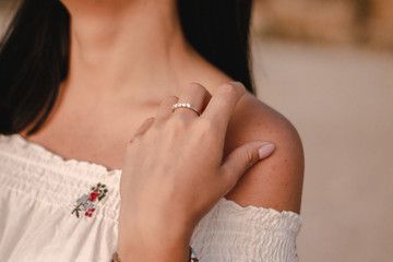 beautiful young brunete woman enjoys the beautiful view on the beach and has a good sunrise time. Relax