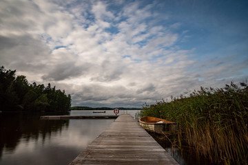 Fototapeta na wymiar lake in Sweden with a landing stage in the foreground