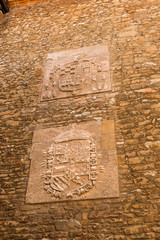 Oviedo, Spain. Ancient bas-reliefs in the courtyard of the Old Tower or Forgiveness (Patio de la Torre Vieja o de la Perdonanza)