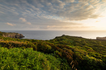 Fototapeta na wymiar Amazing green landscape at sunrise at the mirador de Alagoa of the Agualva coastline on Terceira, Azores