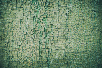 Grungy green wood background. Cracked and old texture