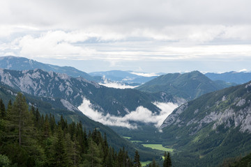 view of clouds in the mountains valley, Alps