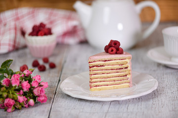 Portion of layered creamy fruit cake. Raspberry layer cake.