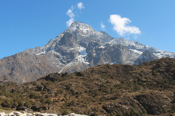 View of Khumbila mountain peak from the plain above the Namche Bazaar town in Himalayas in Nepal....