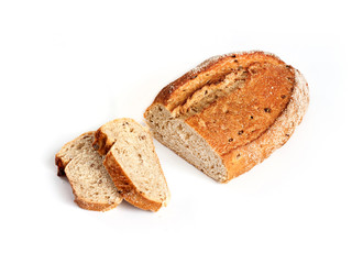Loaf of whole wheat bread with slices isolated on white background