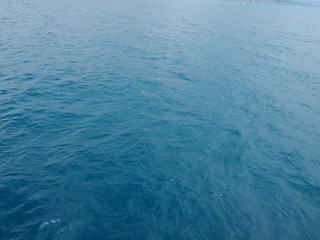 Dark blue water surface. Sea or ocean water background.
