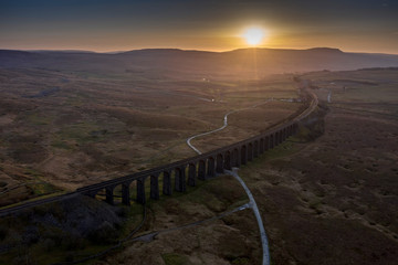 Ariel picture of Yorkshire landmark Ribblehead Viaduct, North Yorkshire, Yorkshire Dales, Sunrise, Clouds, Railway, Landscape, Grassland, Ingleborough © Julian Hodgson 2019