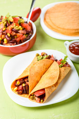 Tacos - delicious tortillas with meat and vegetables