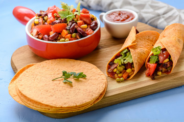 Tacos - delicious tortillas with meat and vegetables