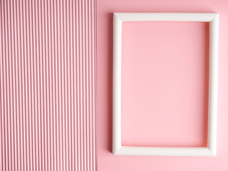Fototapeta premium Abstract pink colored paper texture minimalism background. Minimal geometric shapes and lines composition with empty picture frame.