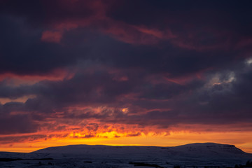Fototapeta premium sunrise over penyghent covered in snow