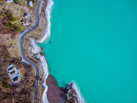 Aerial zenital view of amazing colorful Barcis green lake in Friuli Venezia Giulia. Nature trekking destinations and Mountain tourism icon © Michele Milanese