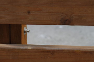 Detail of backrest made of wood. Wood background. Row of seats made of natural wood.