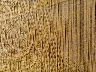 Furrows rows in a plowed field prepared for planting potatoes crops in spring.