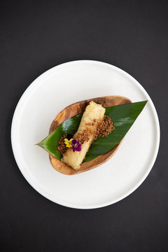 Filipino dessert wrapped in banana leaves