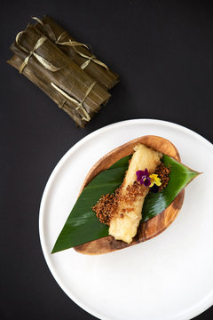 Filipino dessert wrapped in banana leaves