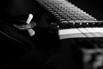 electric guitar, black & white, close-up