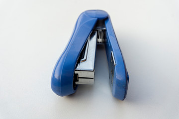 Blue stapler isolated on white background.