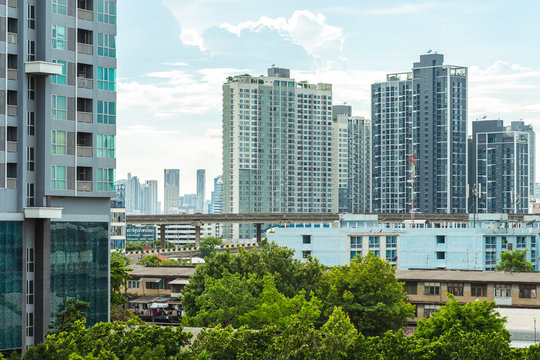 Modern and affordable real estate in Bangkok, Thailand: multistory condominiums of Khlong Toei District. Stock image with logos deleted.