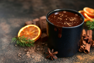Homemade christmas hot chocolate with orange and spices.