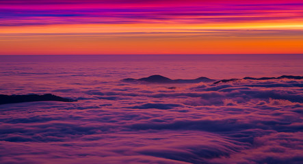 beautiful sunset or sunrise with color sky on the mountain with sea of clouds