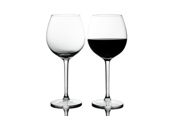Empty Crystal wine glasses with wine isolated on white background. Alcohol beverage card backdrop.