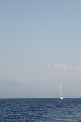 Obraz premium The solar coast of the Mediterranean Sea with yachts and clouds 