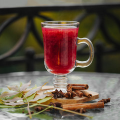 Mulled wine in  glass. Traditional Autumn Drink.