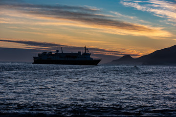 Fototapeta premium Ship in Antarctica at sunrise