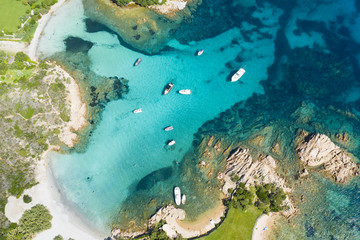 View from above, stunning aerial view of some boats and luxury yachts floating on a turquoise...