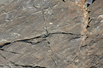 Texture of dark gray and black slate or background for design..Wall of a rock surface with an abstract pattern.