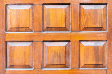 wooden surface with carved squares, background, texture