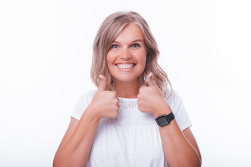 Photo of cheerful woman, showing thumbs up over isolated background