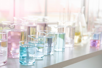 Chemical tube set development and pharmacy in laboratory with multicolored substances in laboratory