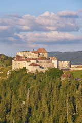 View Of Chateau de Joux, and The Surrounding Mountains