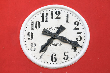 Old watch in red background