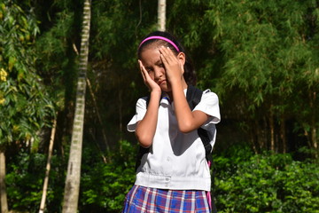 Stressed Cute Filipina Person With Books