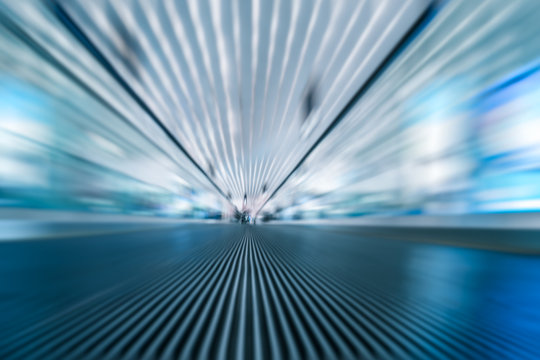 blurred motion of airport moving walkway