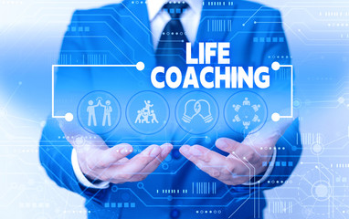 Fototapeta na wymiar Word writing text Life Coaching. Business photo showcasing Improve Lives by Challenges Encourages us in our Careers Male human wear formal work suit presenting presentation using smart device