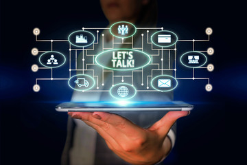 Word writing text Let S Is Talk. Business photo showcasing suggesting in the beginning of a conversation on the topic Woman wear formal work suit presenting presentation using smart device