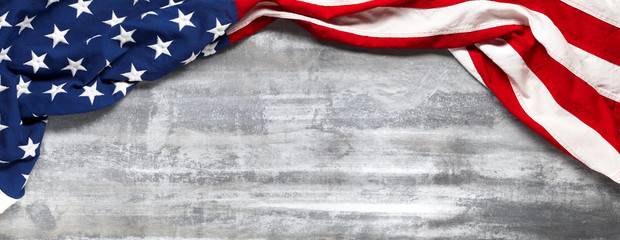 US American flag on worn white wooden background. For USA Memorial day, Veteran's day, Labor day, or 4th of July celebration. With blank space for text. - obrazy, fototapety, plakaty