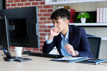 Young asian office man struggle with computer, Frustrated asian business man looking at computer...