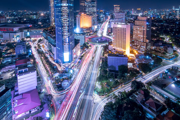 Fototapeta na wymiar Aerial scenic of light trails of vehicles in Jakarta city