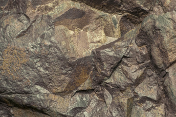 Natural brutal stone background with cracks and creases