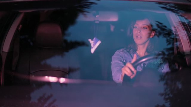 Beautiful Latino Girl Singing Along While Sitting In A Car.