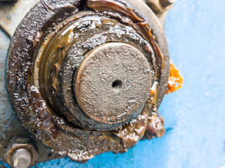 close up bearing support of machine with dirty grease