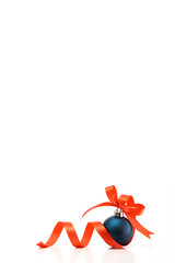 Blue christmas ball with red ribbon on a white