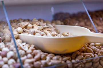 Cashew nuts on the store counter, close-up.