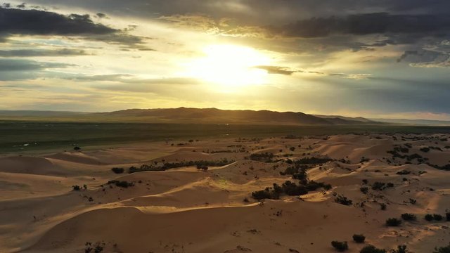Aerial view of the sand dunes Elsen Tasarhai (Bayan Gobi) at sunset in Mongolia, 4k