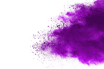Freeze motion of purple color powder exploding on white background.